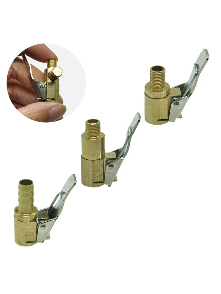 A set of brass and silver portable inflatable tire pump adapters for automotive valves.