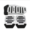 A set of silver and black sports pedal covers for a car pedal.