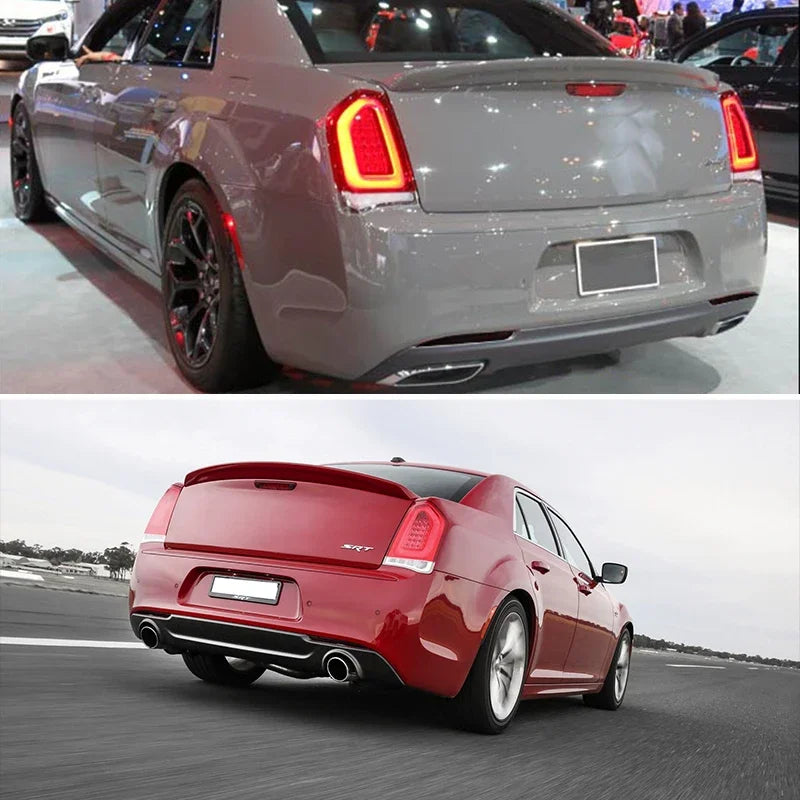 A red Chrysler 300 is driving on a road, showing the rear bumper and taillight area.