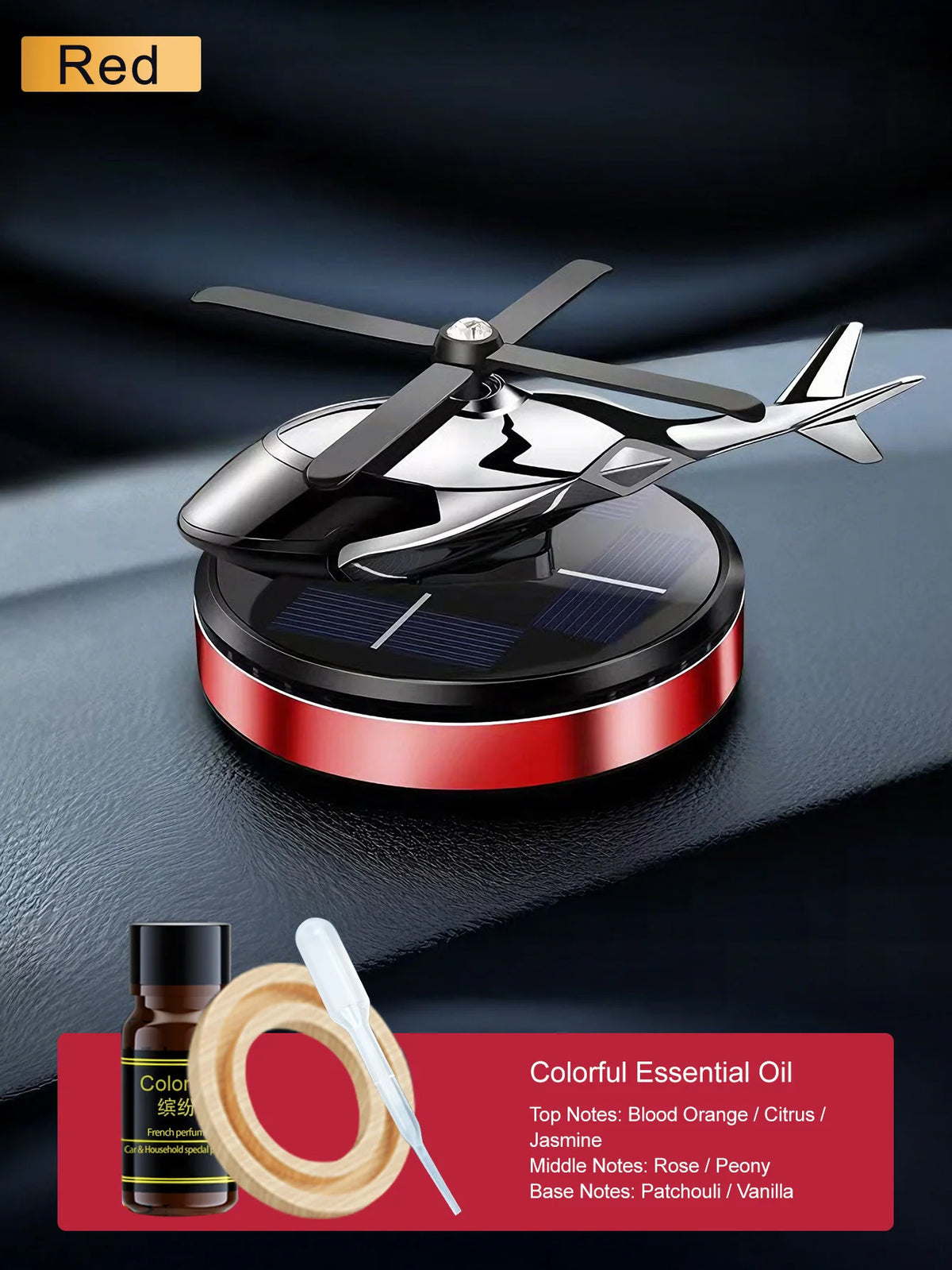 Parfum voiture solaire noir rotatif avec base rouge et détails d'huile essentielle sur une surface sombre.