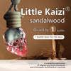 A glass bottle of Little Kaizi sandalwood air freshener with a skull-shaped top, showing the product and usage information.