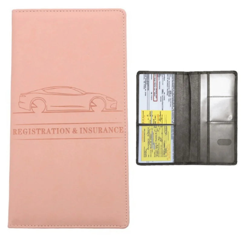 A pink leather card holder wallet with a clear window displaying registration and insurance documents.