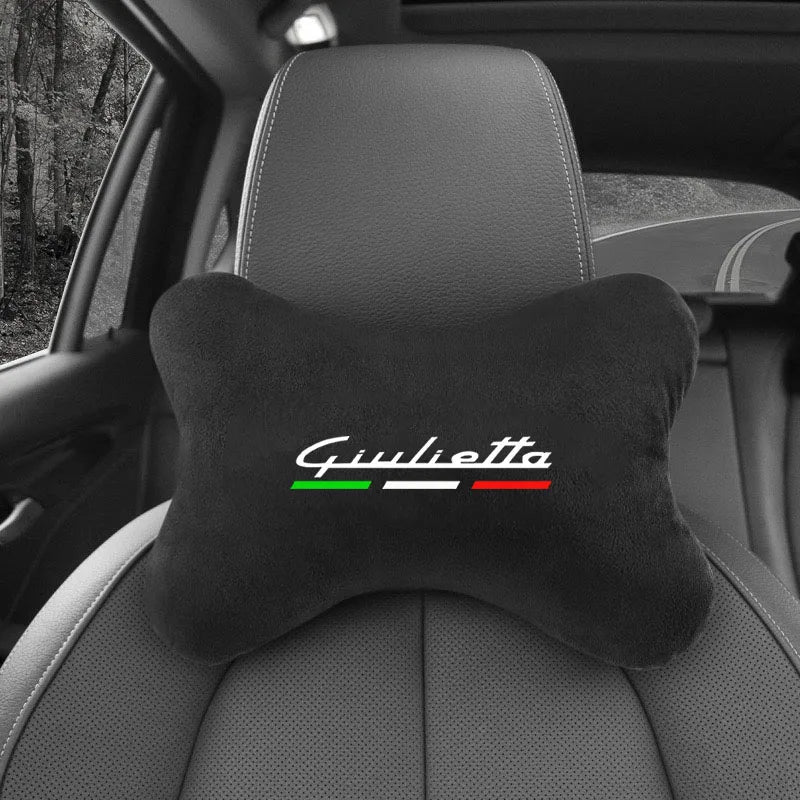 Black shoulder cushion with the name Giulietta and a green and red racing stripe on a car seat.