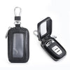 A black retro leather car key protector pouch with a silver clasp and clear window.
