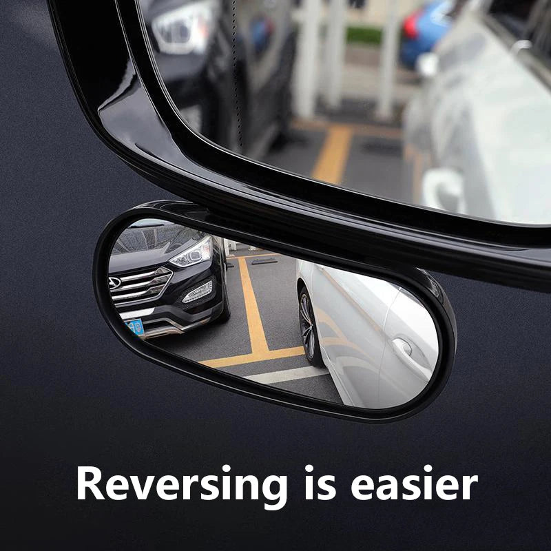 A close-up view of a car's side mirror showing a reflection of a vehicle and text that says Reversing is easier.