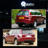 Rear view of a red Subaru Forester with LED bumper reflector lights installed.