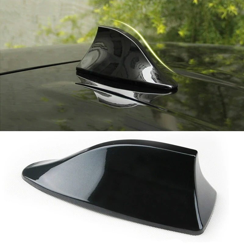 A black universal car shark fin antenna cover is shown in a close-up view.