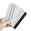 A hand holds a precision scratch-free decal applicator tool with white and black layers.