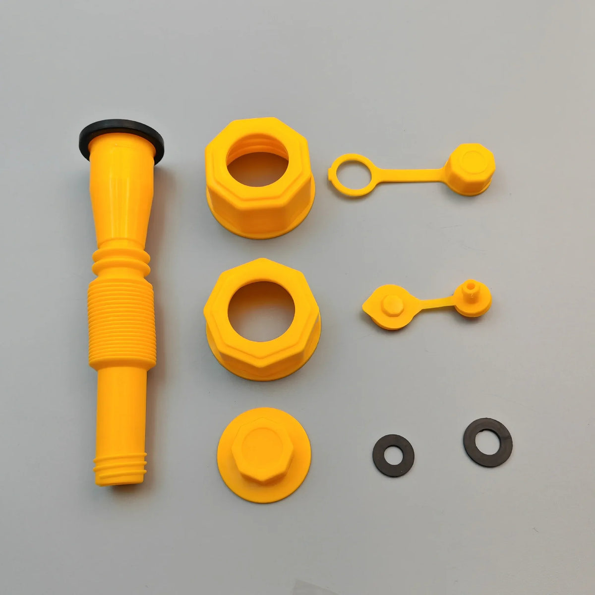 Yellow gas can spout replacement nozzle adapter with various plastic components and fittings