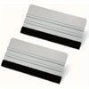 A precision scratch-free decal applicator tool shown in two views, featuring a silver plastic body and a black rubber grip.