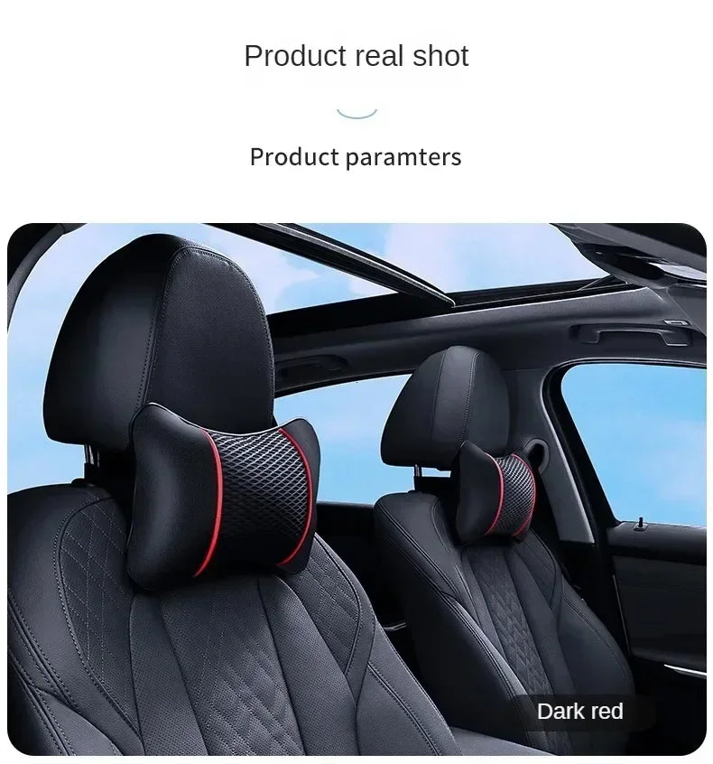 A close-up view of a black ergonomic leather headrest and neck support cushion installed in a car seat.