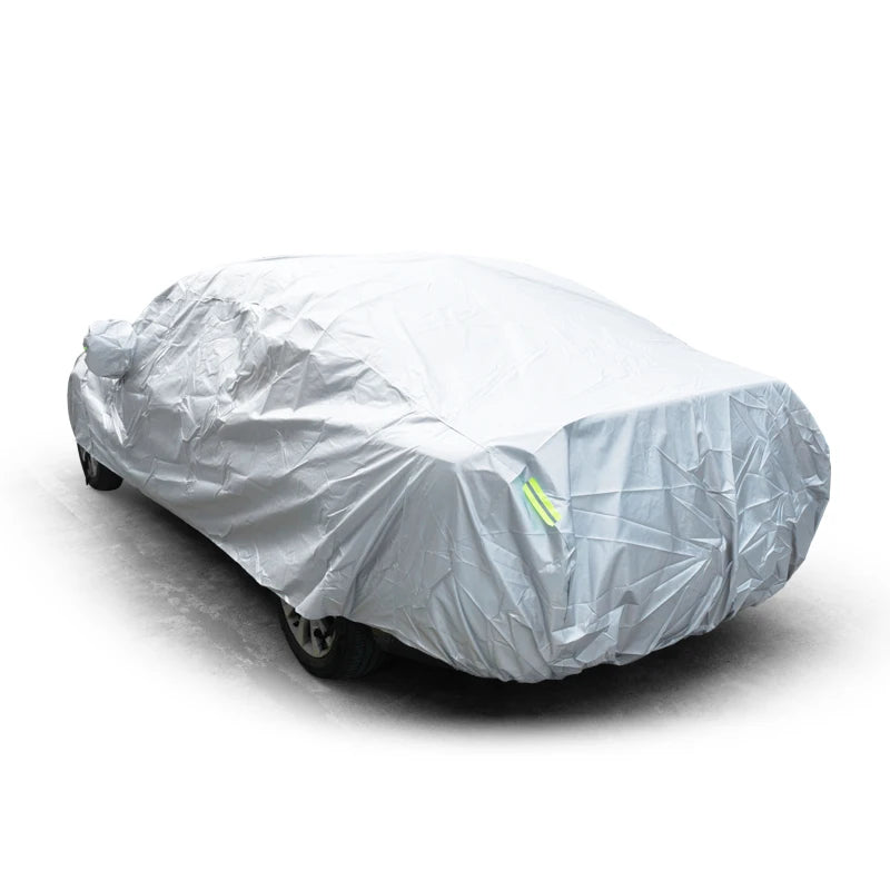 A white all-weather car cover draped over a vehicle.