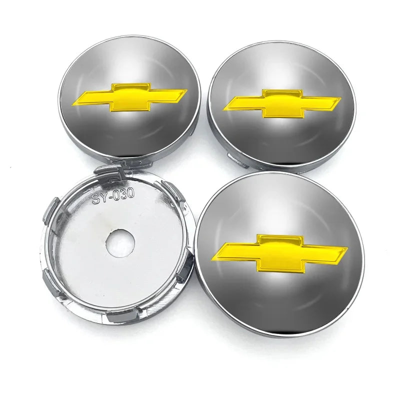 Silver car wheel hub center caps with yellow flame decorative accents