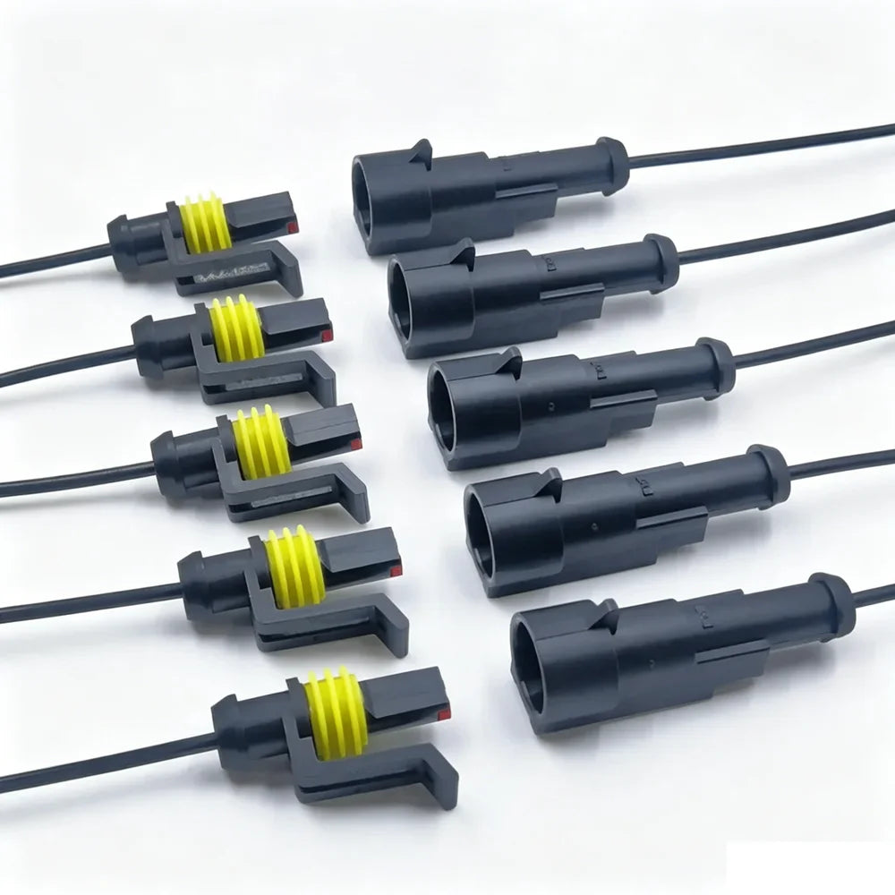 A collection of waterproof electrical connectors with pre-wired leads in black and yellow.
