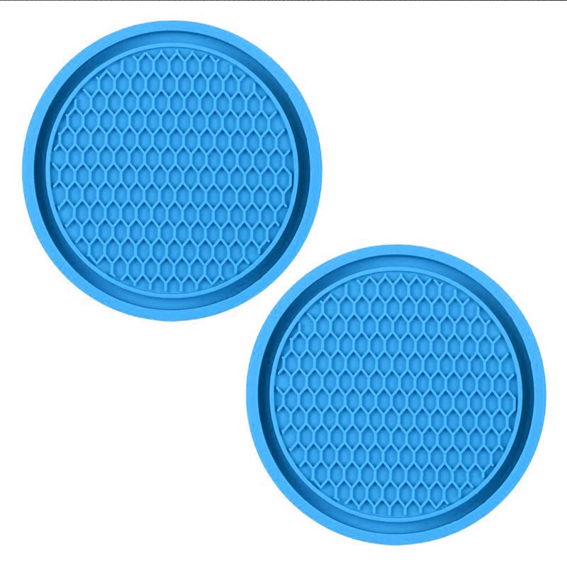 A set of light blue decorative rhinestone car coasters with a honeycomb pattern.
