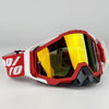 A pair of red and white off-road motorcycle riding goggles with yellow tinted lenses.