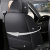 A close-up view of a black car seat with leather covers, showing stitching and an arrow pointing to the seat cushion.