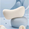 A light beige car neck pillow resting on a light blue surface with soft, flowing background elements.