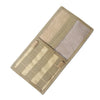 Tactical visor organizer with MOLLE pouch featuring tan and gray fabric strips.