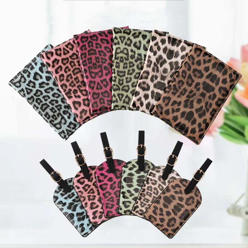 A set of nine leopard print passport holders in various shades and patterns displayed on a white surface.