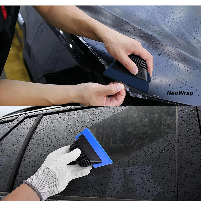 A hand applies a blue cleaning squeegee to wipe a car window or surface.