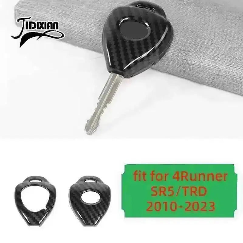A black carbon fiber grain key fob for a Toyota 4Runner interior and exterior decoration.