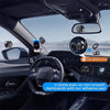 A close-up view of a 360° rotating magnetic phone mount installed in a car's interior, demonstrating its use on various dashb