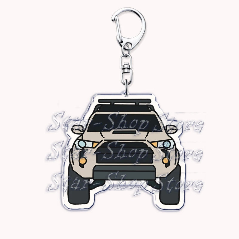 Silver acrylic keychain featuring a detailed model of an off-road truck.