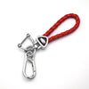 A red leather cord key fob with a silver metal clasp and decorative silver hardware.