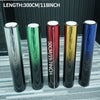 A row of five long, cylindrical color-changing window tint films displayed against a gray background.