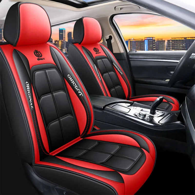 Red and black leather car seat covers installed in a vehicle interior.