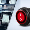 Close-up of a red toggle switch for a high-intensity LED light bar used in an off-road vehicle context.