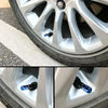 Close-up view of aluminum alloy tire valve caps inserted into the valve stem of a tire.