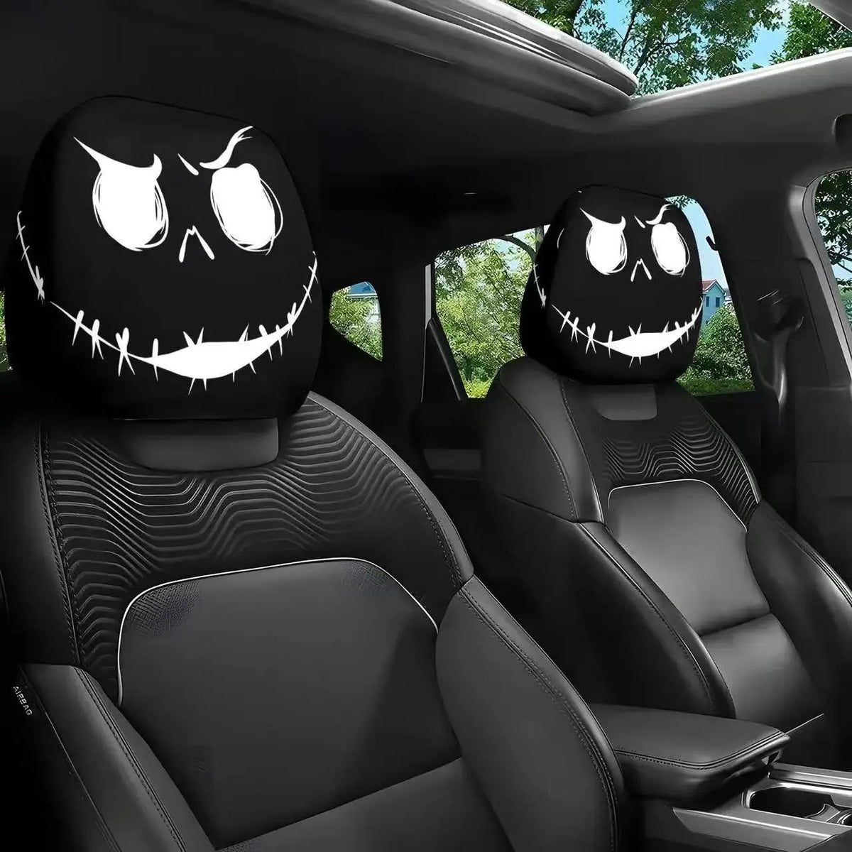 Two black horror themed skull car headrest covers installed in a vehicle interior.