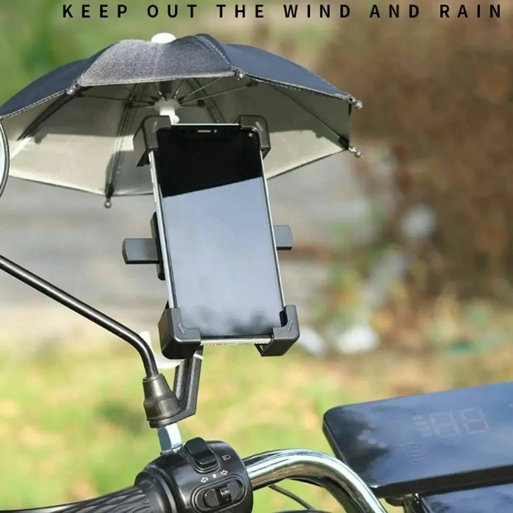 A black mini motorcycle sunshade umbrella is mounted on a bike handlebar, protecting a smartphone.