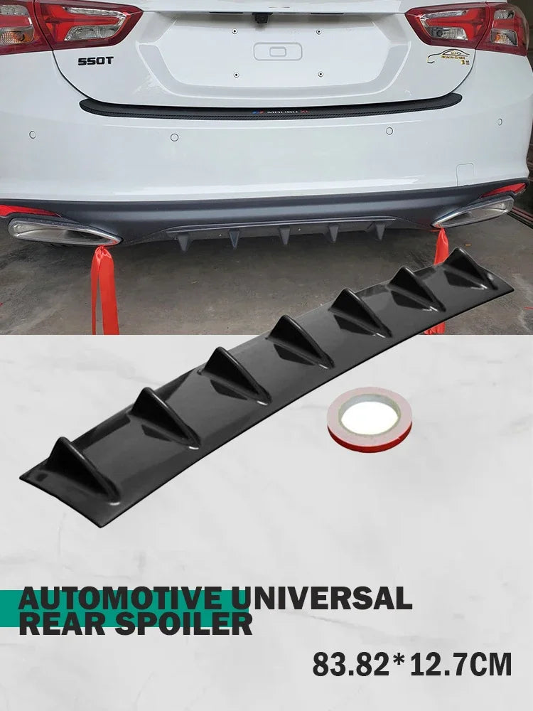 Gloss black automotive universal rear spoiler diffuser for a car bumper.