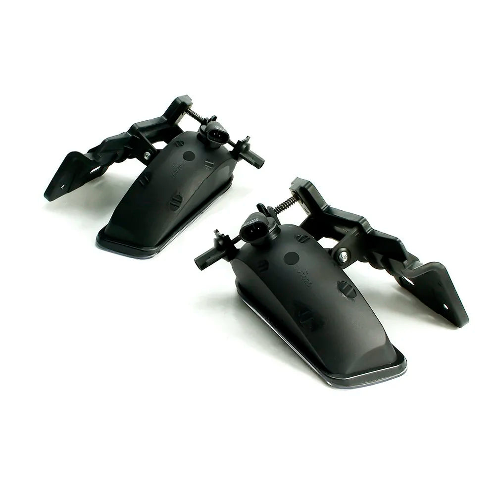 A pair of clear lens fog light assemblies for Chevy Silverado, Suburban, and Tahoe.