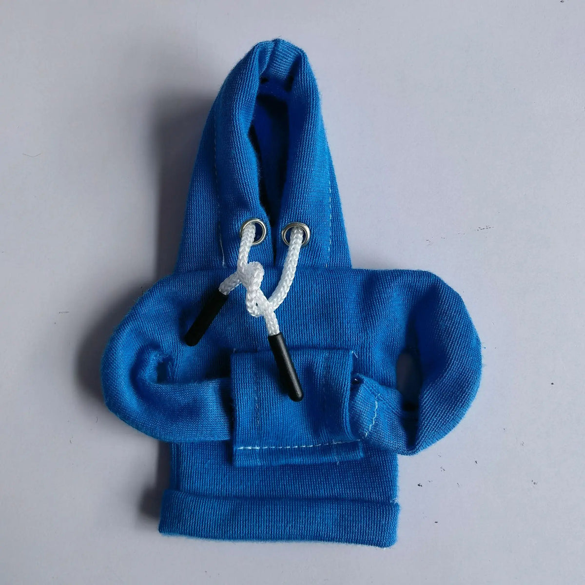 A bright blue gear shift hoodie cover with a white drawstring and black accents.