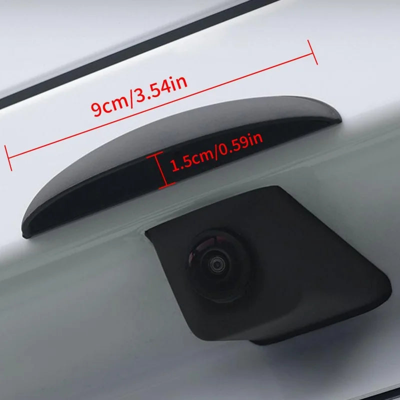 A black anti-fog waterproof rear camera rain cover is shown mounted on a white surface with dimension markings.
