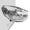 Clear plastic headlight lens with internal reflector visible
