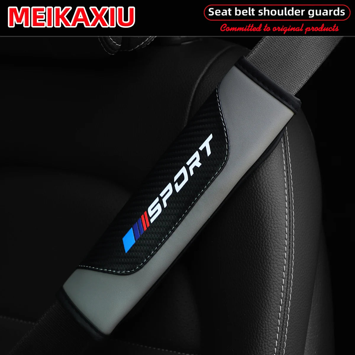 Black and gray PU leather carbon fiber seat belt shoulder guard installed on a car seat.