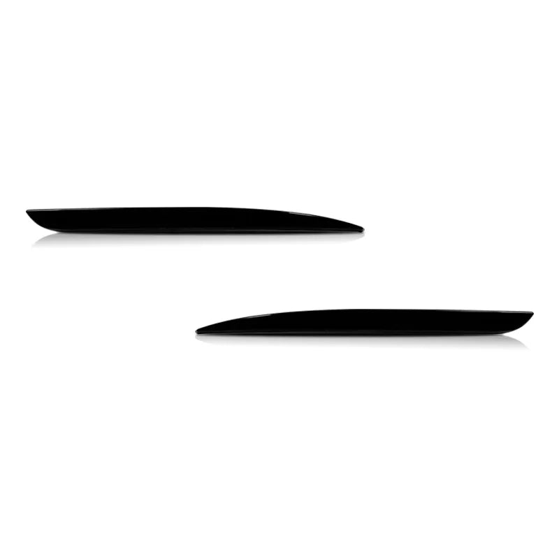 Two black rear bumper reflector light covers for a Chrysler 300 displayed against a white background.
