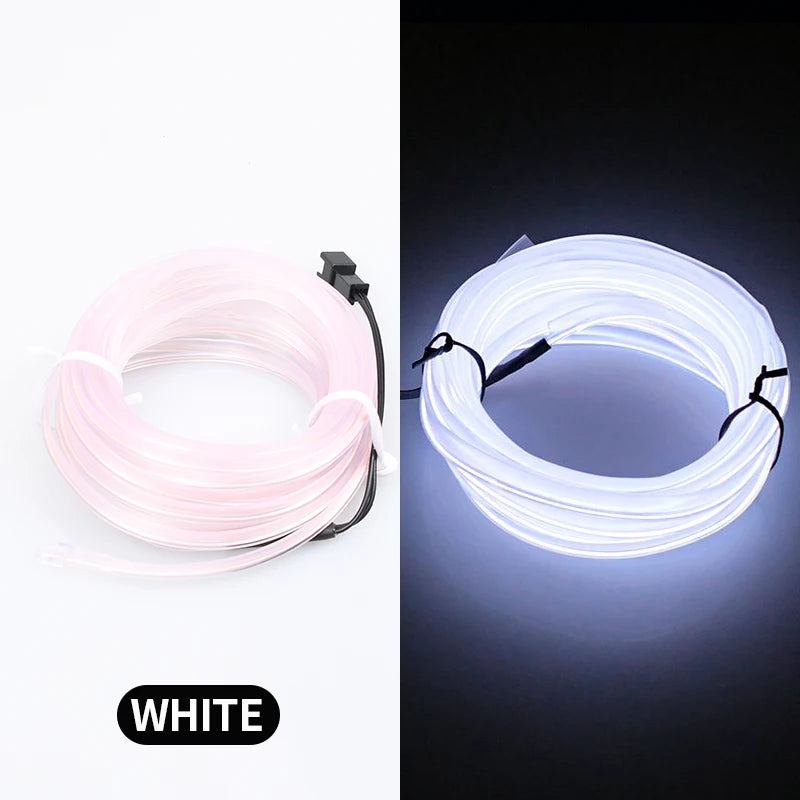 A white flexible LED strip light coiled in a circular shape, showing its glow against a dark background.