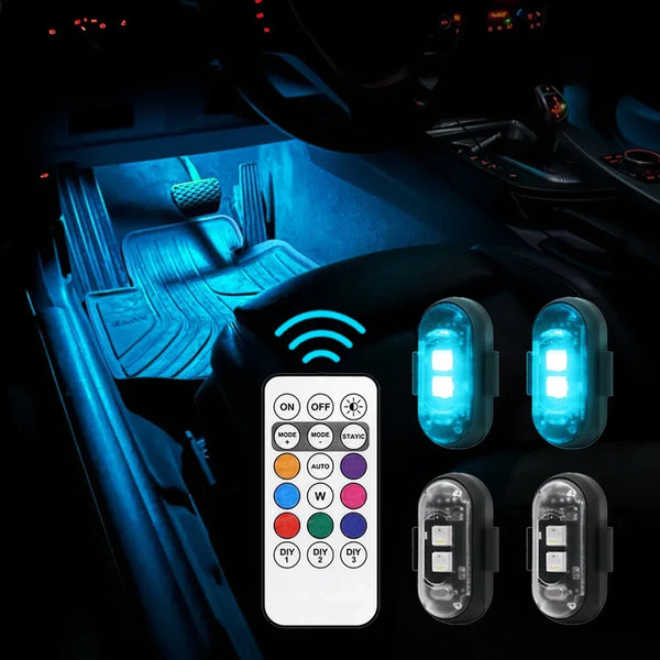 Vista interior de un coche mostrando luces de pie RGB inalámbricas y botones de control.