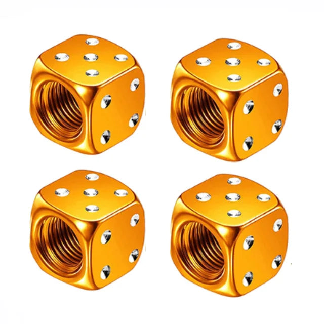A set of four gold-colored hex aluminum alloy tire valve caps shown from above.