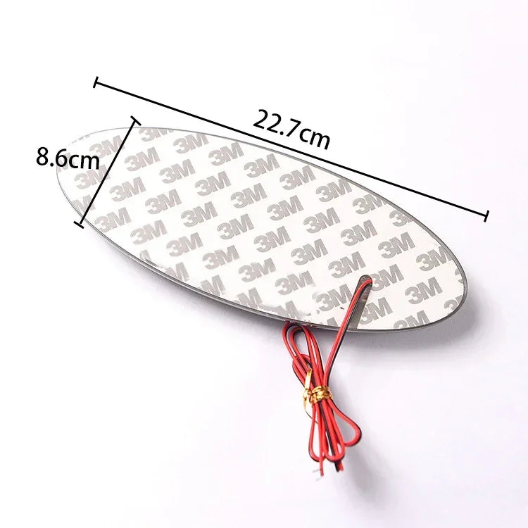 A silver LED front and rear logo emblem for a Ford vehicle, measuring 8.6cm by 22.7cm.