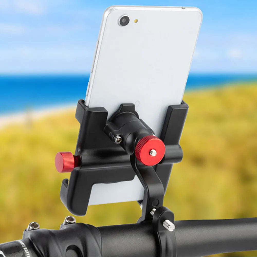 A black adjustable aluminum phone mount is attached to a bicycle handlebar, holding a white smartphone.