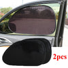 Two black dual car sun shades with UV protection shown in a vehicle window frame.