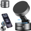 A heavy duty magnetic phone holder with a round base and a flat top, shown next to a smartphone.