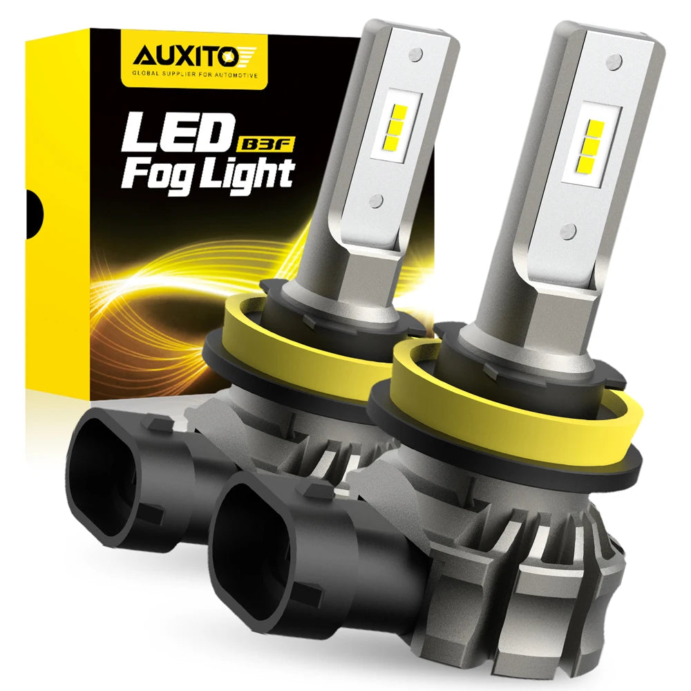 A pair of aftermarket LED fog lights with silver housings and yellow accents are shown next to their packaging box.